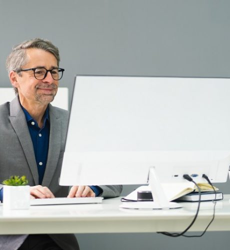 Happy,Professional,Man,Employee,Using,Computer,For,Work
