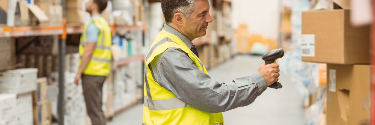 Warehouse,Worker,Scanning,Barcode,On,Box,In,A,Large,Warehouse