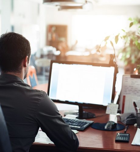 Businessman,Hard,At,Work,On,A,Computer,In,An,Office