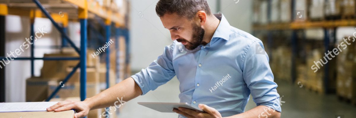 stock-photo-man-warehouse-worker-with-a-tablet-1023035515